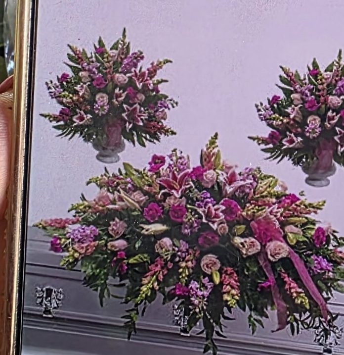 Blush pink casket spray with matching pedestal arrangements